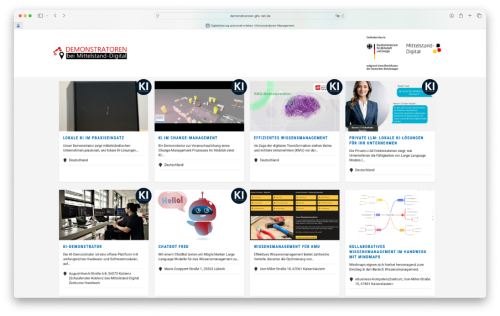Screenshot einer Website mit dem Titel „Demonstratoren bei Mittelstand-Digital“. Zu sehen ist eine Rasterübersicht mehrerer KI-Demonstratoren mit Vorschaubildern und kurzen Beschreibungen, darunter Themen wie lokale KI im Praxiseinsatz, KI im Change-Management, effizientes Wissensmanagement, Private LLMs, Chatbot, Wissensmanagement für KMU und kollaboratives Wissensmanagement. Oben rechts sind die Logos des Bundesministeriums für Wirtschaft und Klimaschutz sowie „Mittelstand-Digital“ eingebunden.